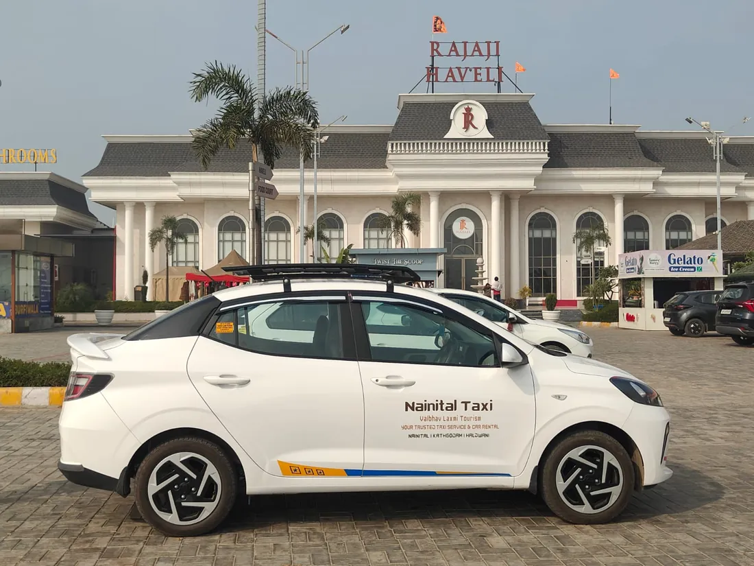 White Hyundai Aura taxi, side view